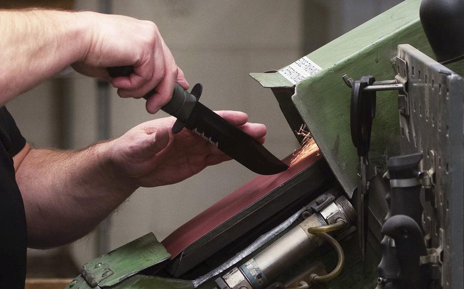 A KA-BAR knife is put through the edge finishing process in the Cutco factory, in Olean, New York, on Nov. 20, 2019.  KA-BAR has been issuing knives to the Marine Corps since Dec. 9, 1942. 