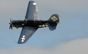 The Commemorative Air Force proudly performs the world's only flying example of the Navy Curtiss-Wright SB2C Helldiver for the crowd of Joint Service Open House 2012. This year's JSOH celebrates the Centennial of Marin Corps Aviation.  JSOH affords the public an opportunity to meet the men and women of the armed forces while viewing more than 100 static displays and 19 aerial demonstration teams.
