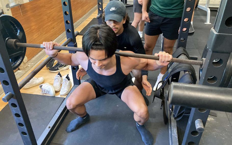 Ryan Hater lifts weights.