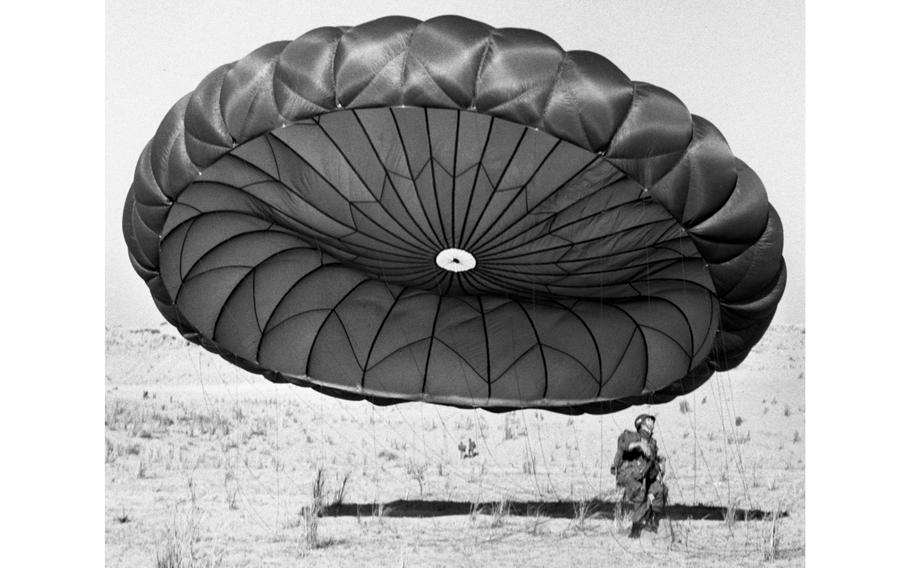 With his parachute closing in on him, Spec. 4 Joseph D. Langham of Headquarters and Headquarters Co., 187th Infantry, hits the ground during an exercise in Lebanon. Langham was one of about 14,000 U.S. soldiers and Marines sent into Lebanon as part of Operation Blue Bat, an effort to shore up the beleaguered government of President Camille Chamoun.