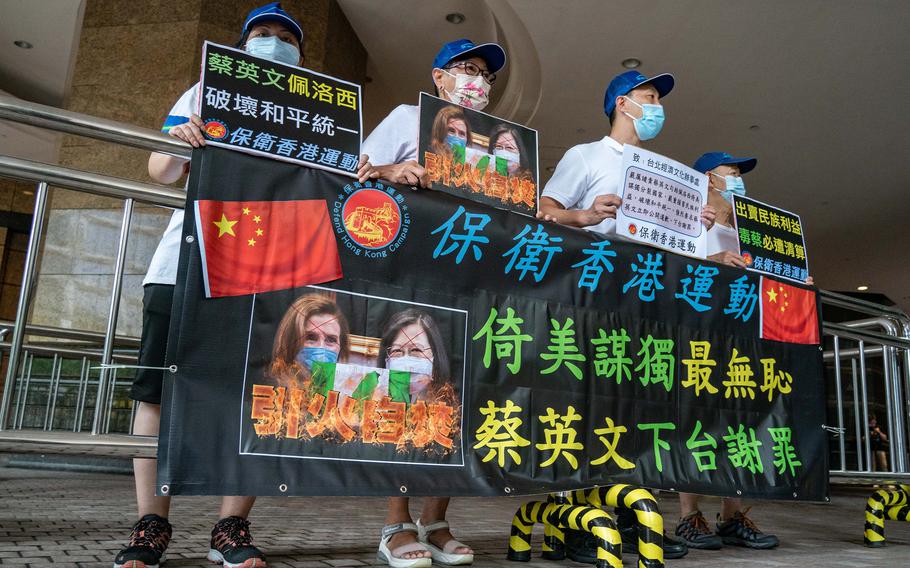 Pro-China supporters protest against U.S. House of Representatives Speaker Nancy Pelosi's visit to Taiwan on Aug. 11, 2022, in Hong Kong.