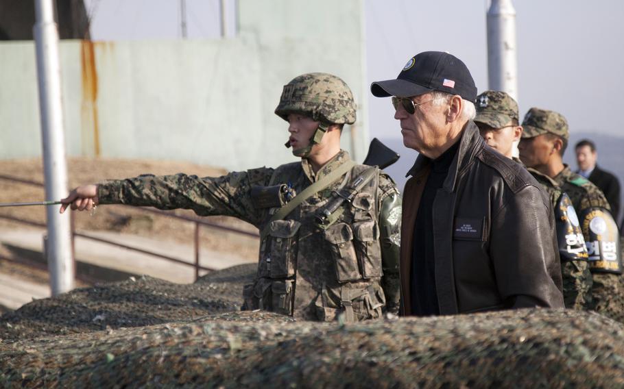 Then-Vice President Joe Biden gets a glimpse of North Korea from the Ouellette observation point inside the Demilitarized Zone, Dec. 7, 2013. 