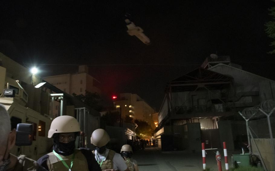 Staff evacuate the U.S. Embassy in Kabul shortly after midnight on Sunday, Aug. 15, 2021. Hundreds of people traveled by helicopter from the embassy to the city’s airport overnight. The insurgents entered Kabul’s outer suburbs later Sunday. 