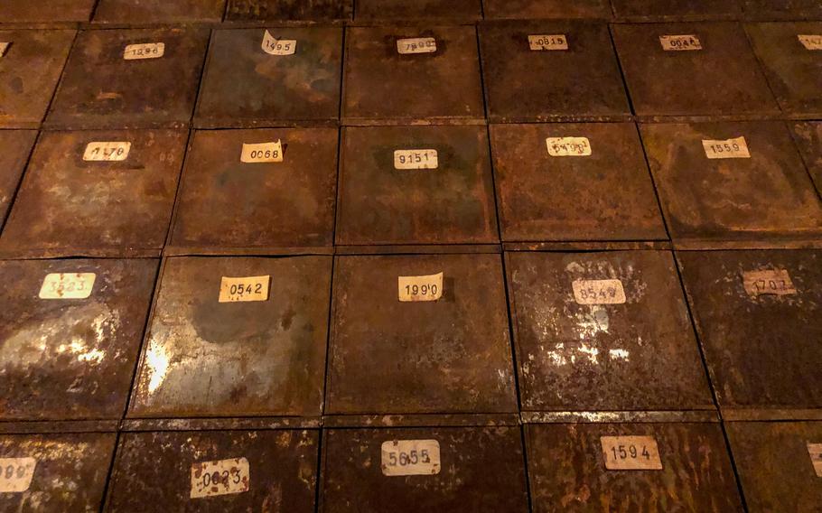Hundreds of numbered metal boxes create a floor-to-ceiling hallway at Voelklingen Ironworks in Voelklingen, Germany. 