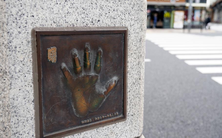 The handprint of sumo legend Akebono is preserved in bronze in front of Ryogoku Station in Tokyo. 