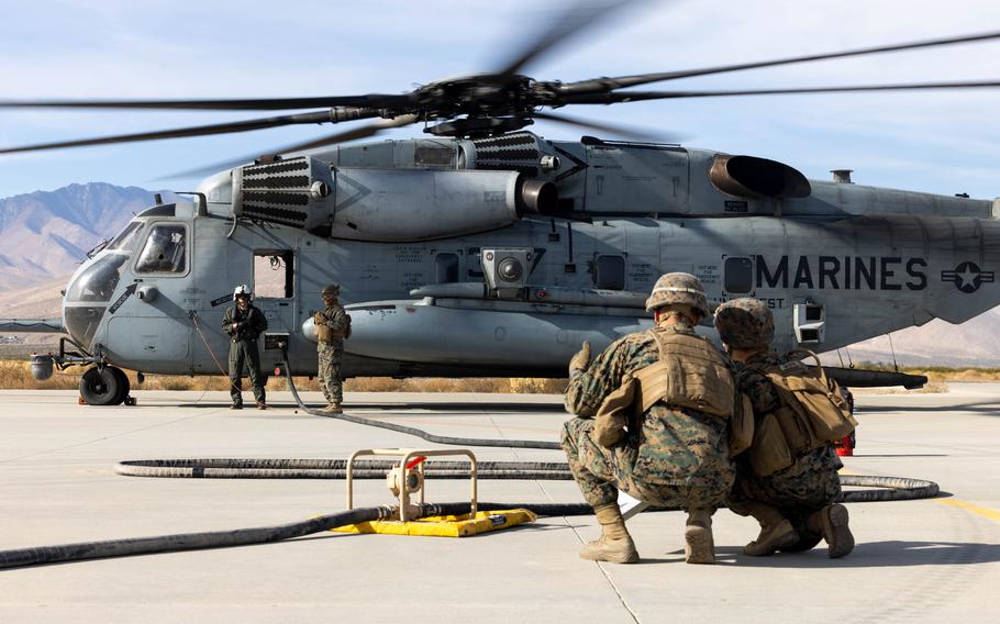 Marines refuel a CH-53E Super Stallion helicopter with the Marine Heavy Helicopter Squadron 361, Marine Aircraft Group 16, 3rd Marine Aircraft Wing at Inyokern Airfield, Calif., Dec. 2, 2023. 