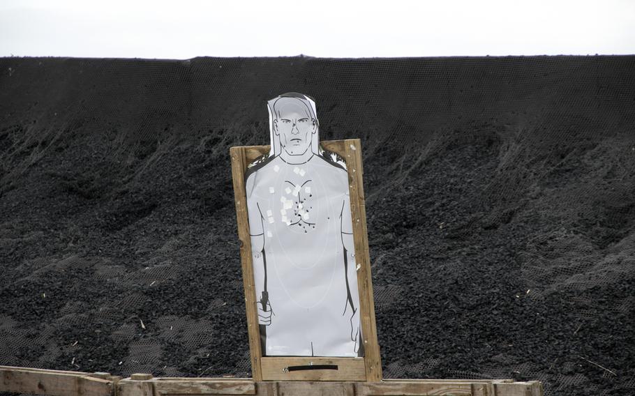 A target at the Camp Hansen pistol range is marked with bullet holes during the Far East Marksmanship Competition on Okinawa, Dec. 7, 2022.