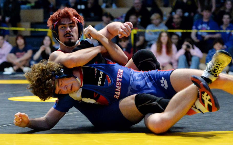 Lakenheath’s Lucius Bowman has a hold on Ramstein’s Lucas Hollenbeck in an exciting 165-pound championship match at the DODEA-Europe wrestling finals in Wiesbaden, Germany, Feb. 10, 2024. Hollenbeck was able to turn the table on Bowman, to take the title.