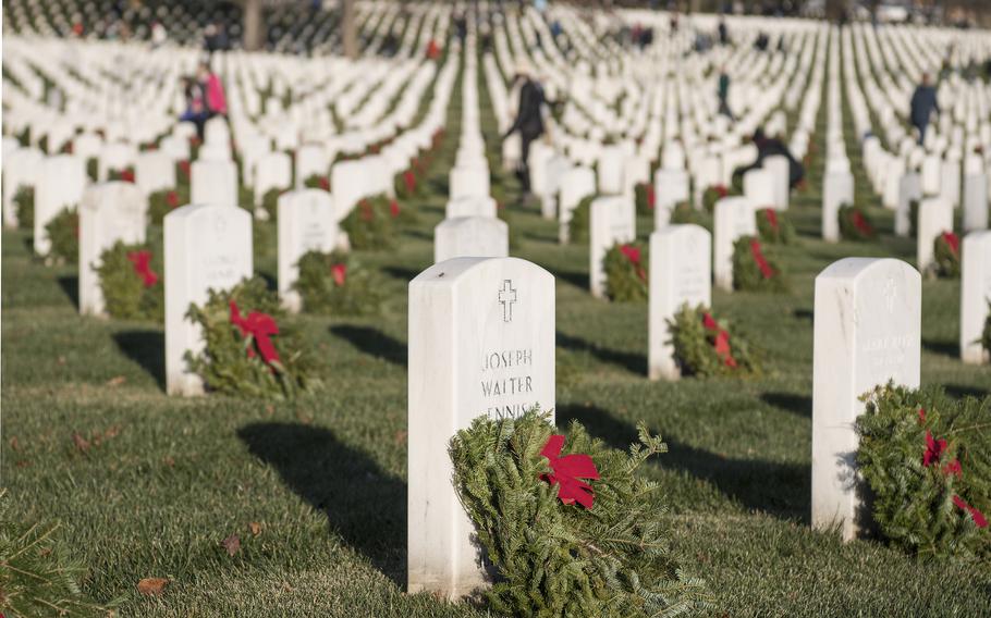 Tens of thousands of volunteers helped place more than a quarter-million wreaths at Arlington National Cemetery on Saturday, Dec. 17, 2022.