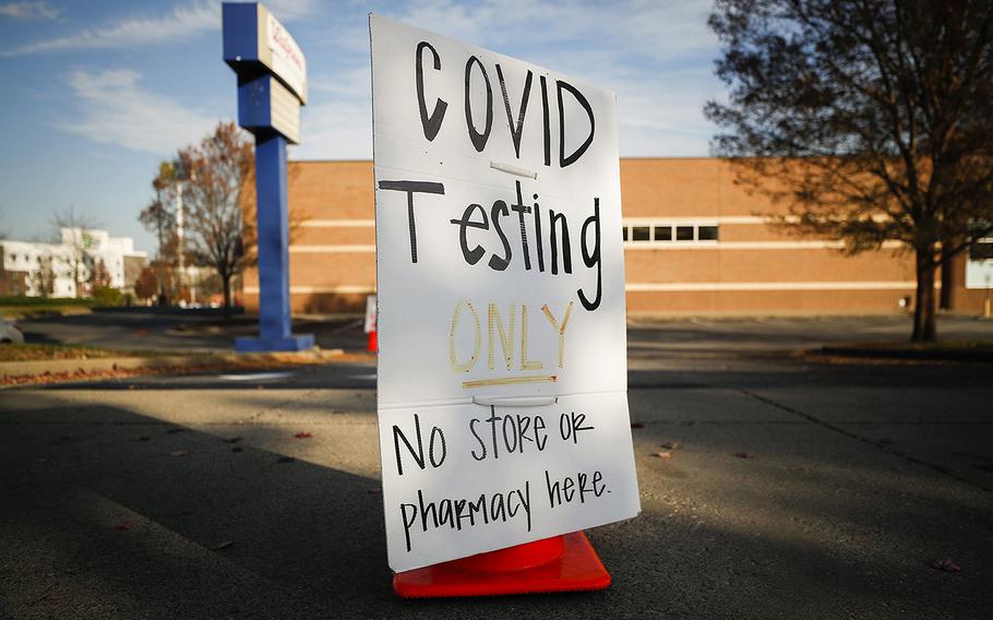 A sign informing people of COVID-19 testing sits in front of a Walgreens in Lexington, Ky., in 2020.