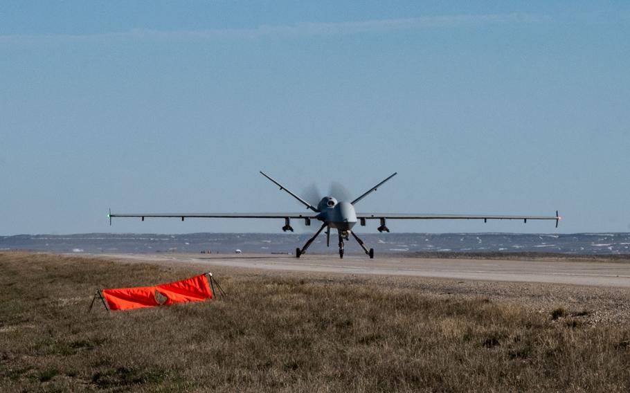 An MQ-9 Reaper lands on a highway near Rawlins, Wyo., during Exercise Agile Chariot on April 30, 2023. Instead of relying on large, fixed bases and infrastructure, air crews practiced using smaller, more dispersed locations in line with the Air Force’s Agile Combat Employment concept.