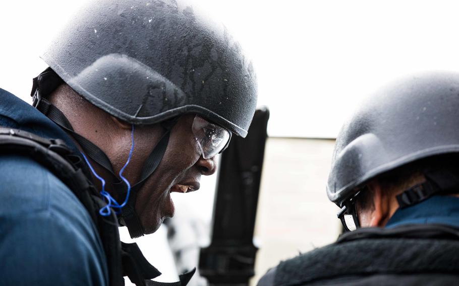 Chief Petty Officer Caprice Pryor instructs Petty Officer 2nd Class David Ramirez on firing a .50-caliber machine gun during a live-fire exercise on the destroyer USS Ramage on Oct. 26, 2022. Pryor was medically evacuated from the destroyer on June 8, 2023, and died the same day, U.S. Naval Forces Europe-Africa/U.S. 6th Fleet said in a statement on June 10, 2023.  