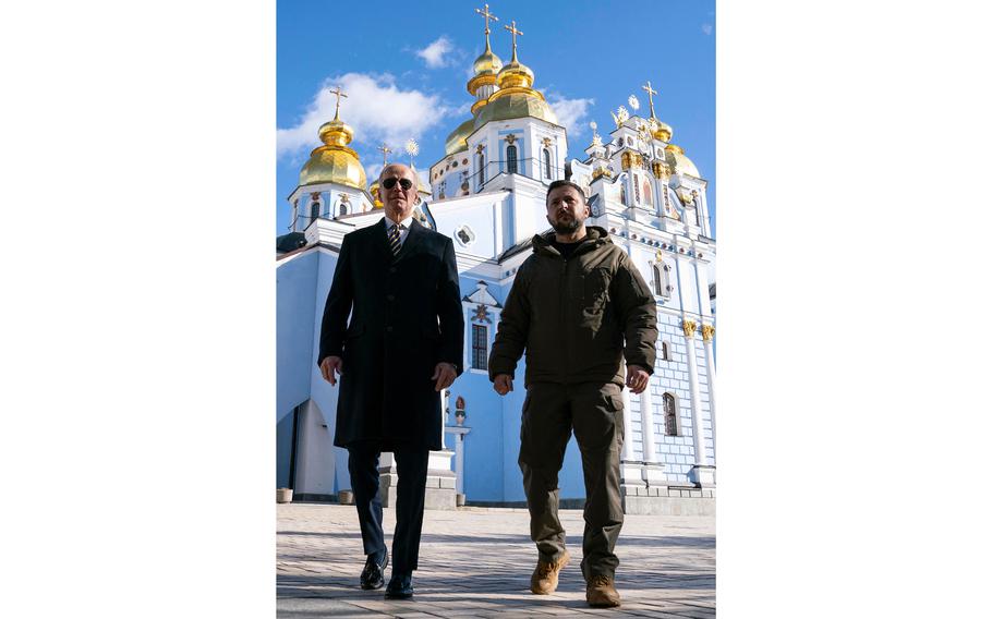 U.S. President Joe Biden walks with Ukrainian President Volodymyr Zelenskyy in front of St. Michael’s Golden-Domed Cathedral during an unannounced visit in Kyiv on Monday, Feb. 20, 2023.