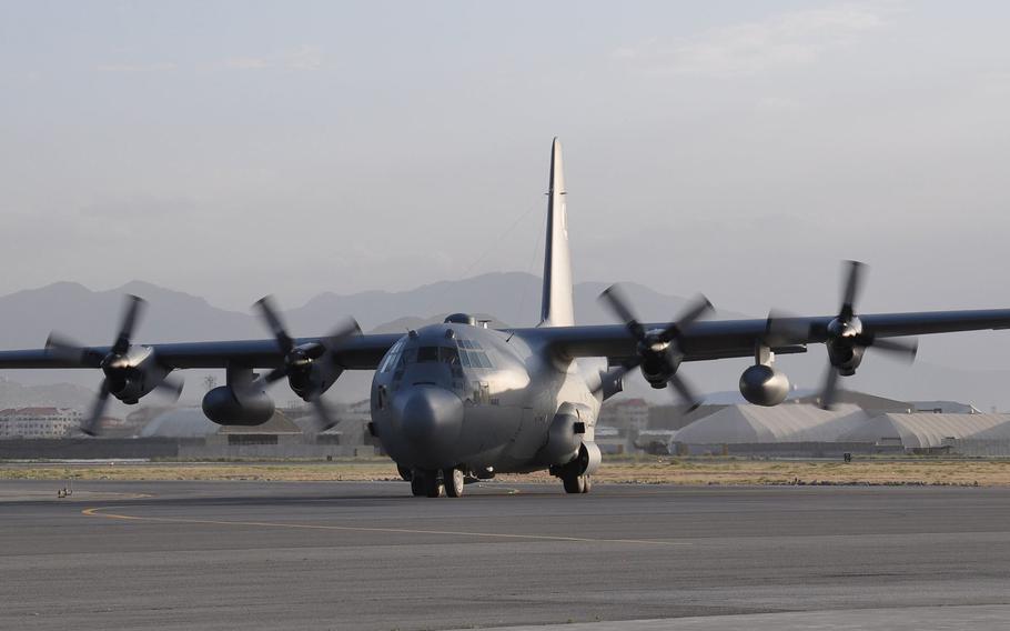 A C-130 Hercules touches down at Hamid Karzai International Airport, Kabul, June 20, 2015. The Pentagon announced on Thursday, Aug. 12, 2021, that three infantry battalions would be deployed to the airport to help evacuate U.S. diplomats. 