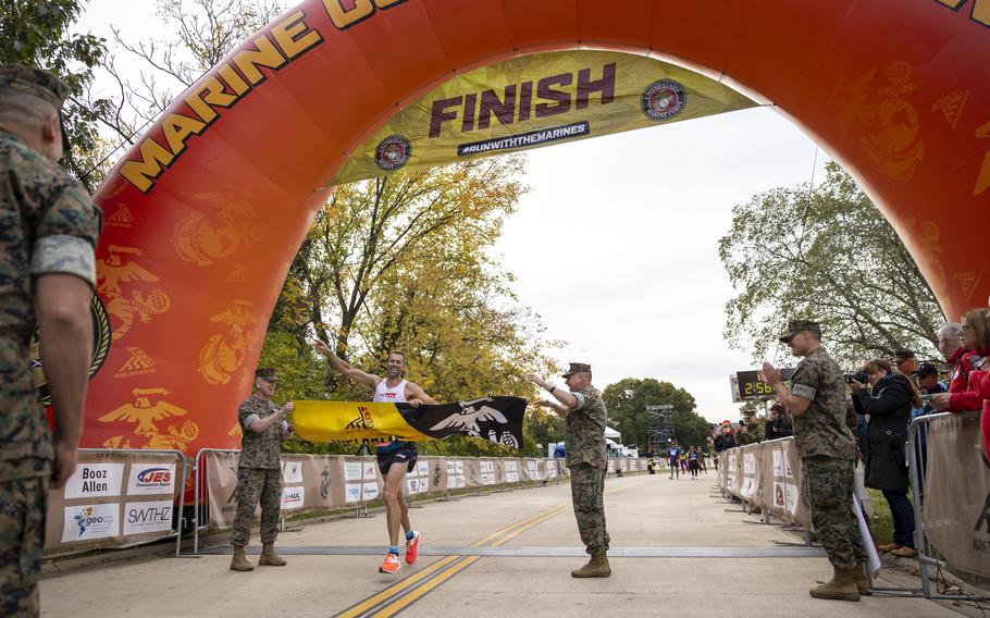 Calum Neff crosses the finish line