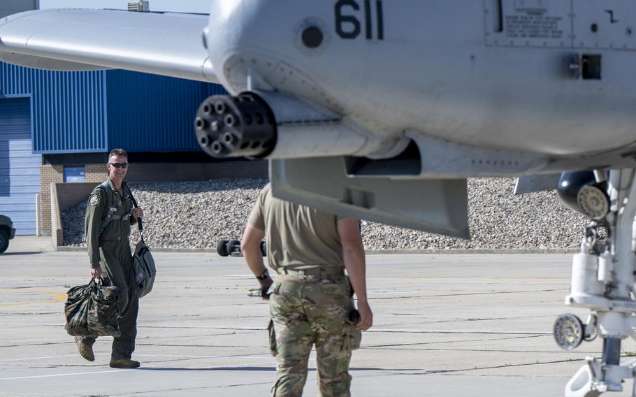 An airman walks to an aircraft