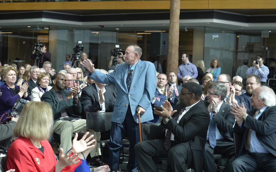 Korean War Medal of Honor recipient and Detroit native Marine Corps Pfc. Robert E. Simanek, 85, is recognized by former Sen. Carl M. Levin, elected officials and distinguished guests during a naming ceremony at the GM Renaissance Center in Detroit in April 2016. 