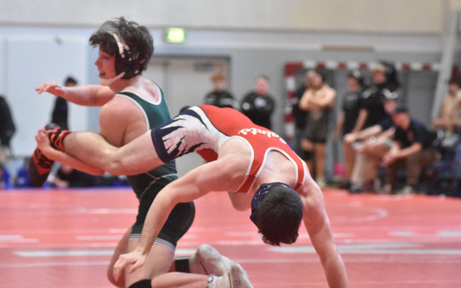 Aviano's Jevan Smith flips over Naples' Sam Pounds in a 150-pound match Saturday, Feb. 4, 2023, at the DODEA-Europe Southern Europe regional at Aviano Air Base, Italy.
