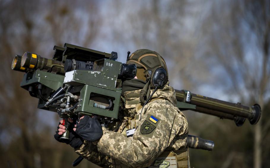 Private R, the missile operator of a Kyiv-area air defense unit, demonstrates the use of dual-mounted stinger missiles during an interview with media at an unused position about 25 miles from Kyiv on Feb. 21, 2023, in Ukraine.