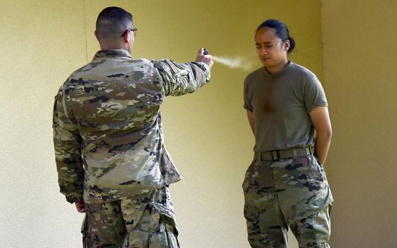 Airman 1st Class Taylor Arias is pepper-sprayed during training at Yokota Air Base, Japan, July 21, 2021. 