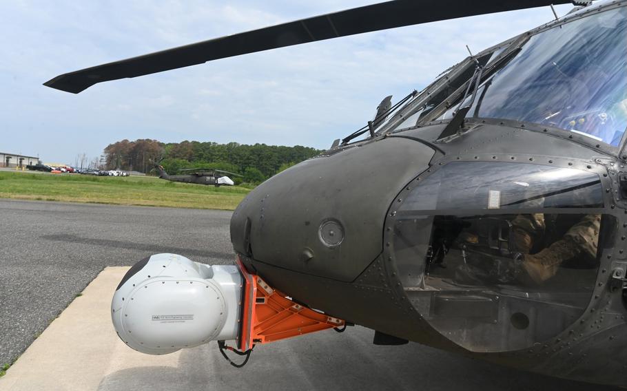 A helicopter idles on a flight line.