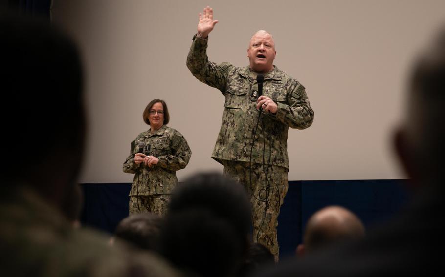 Chief of Naval Operations Adm. Lisa Franchetti listens to Master Chief Petty Officer of the Navy James Honea speak during a visit to Naples, Italy, to tour facilities and meet with sailors and civilians on Jan. 22, 2024.