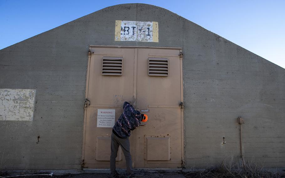 U.S. Geological Survey biologist Jared Heath unlocks the doors of a concrete and steel WWII munitions bunker on the former El Toro Marine Corps Air Station on Wednesday, Dec. 14, 2022, in Irvine, Calif. The bunker is used to store an important collection of invertebrates.