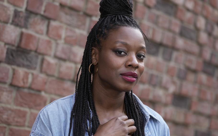 Director Nia DaCosta poses for a portrait in London on Sept. 1 to promote her film “The Marvels.” DaCosta, 33, is the youngest filmmaker to helm an MCU release. She’s also the first Black woman to do so.