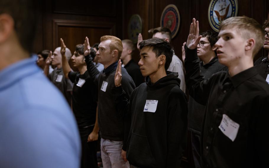 Future Marines recite the oath of enlistment before shipping off to begin basic training at Marine Corps Recruit Depot San Diego at Military Entrance Processing Station Salt Lake City, Utah, on Oct. 24, 2022. MEPS processes applicants for military service, putting them through a variety of tests and examinations to ensure that they meet the standards required to serve in the armed forces.