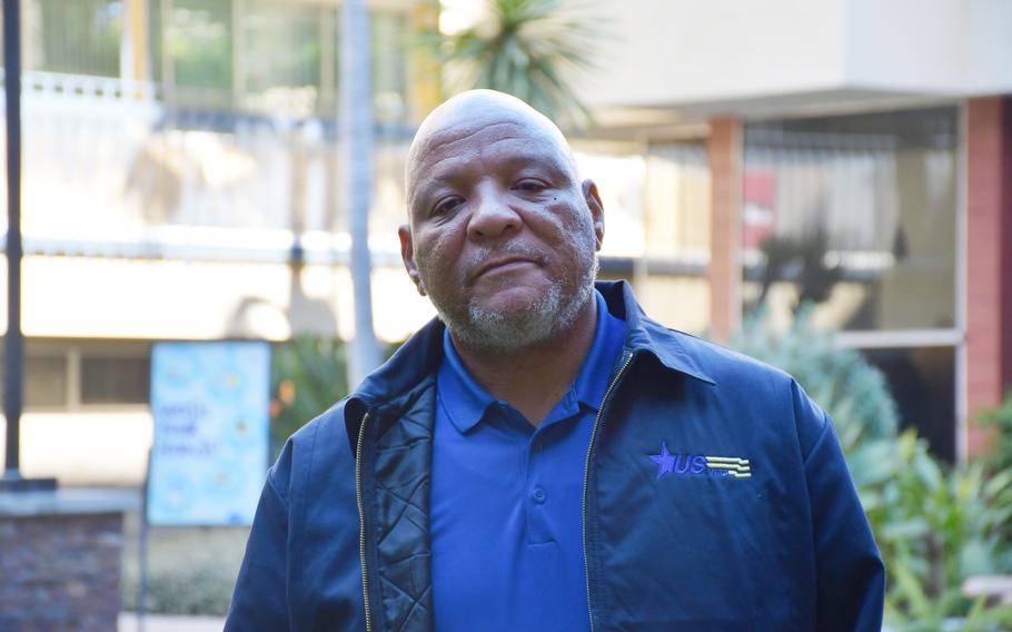 Air Force veteran Kevin Kincey, 58, poses in the courtyard at the U.S. Vets housing complex in Inglewood, Calif., on Thursday, Feb. 24, 2022. Kincey, who experienced homelessness in the 1990s, once received help from U.S. Vets. Now, he’s worked for the organization for 23 years and specializes in veteran outreach. 