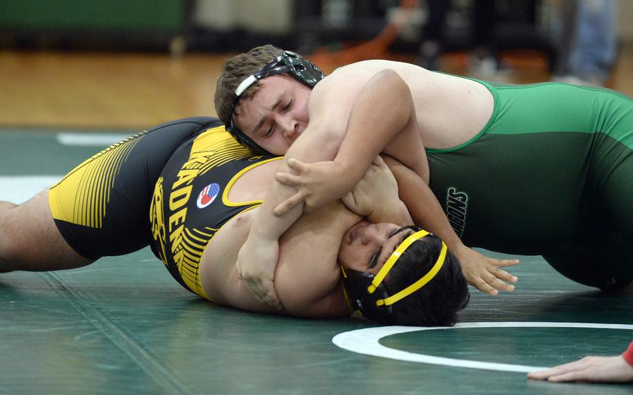 Kubasaki's Anthony Finegan takes control of Kadena's Tristan Diaz at heavyweight during Wednesday's Okinawa wrestling dual meet. Finegan pinned Diaz in 28 seconds, but the Panthers won the meet 31-31 by virtue of more bouts won.