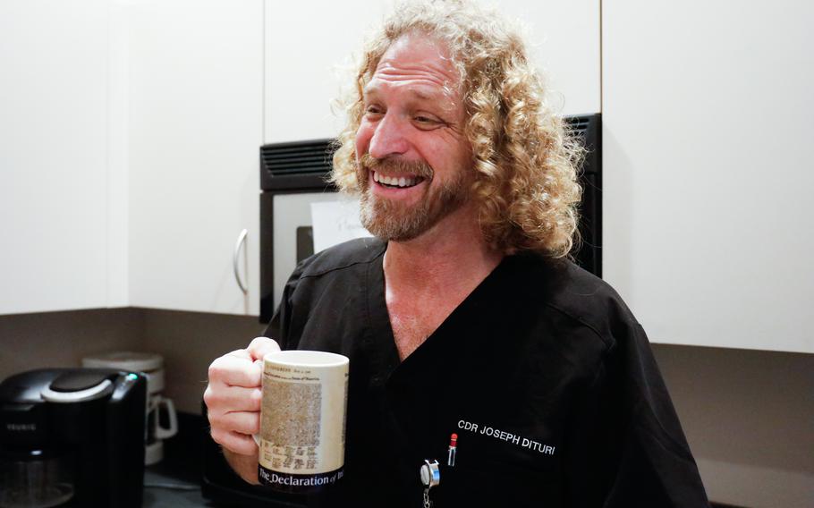 Joseph Dituri enjoys a cup of coffee inside a break room at his office — a small luxury he craved while living underwater.