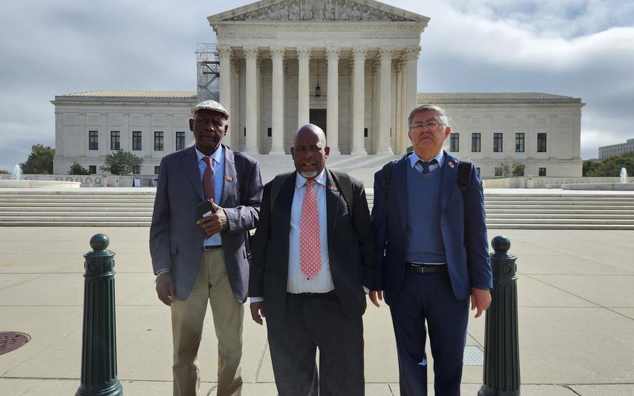 Olivier Bancoult, center, the leader of the Chagos Refugee Group, stands on Capitol Hill with Roger Alexis, a Chagossian, left, and Philip Ah-Chuen, a Mauritian advisor to the group. They met last week with lawmakers to demand reparations and an apology for the forced removal of thousands of Native inhabitants from the Chagos Islands in the 1960s and 1970s to make room for a U.S. military base.