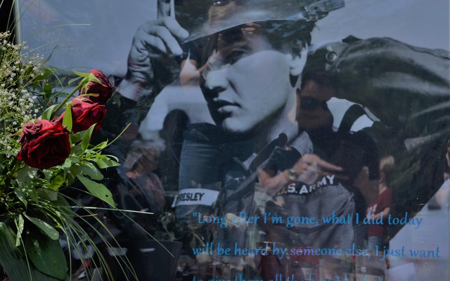 A picture of Elvis Presley when he was a U.S. Army soldier sits near a memorial to him in Bad Nauheim, Germany, Aug. 15, 2021. The text on the photo says, "Long after I'm gone, what I did today will be heard by someone else.I just want to give them all the best I had."