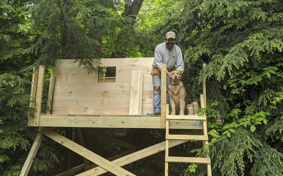 This photo taken by Nanci Butler in 2020 shows her husband, Ethan, in the backyard treehouse they built during the Covid-19 pandemic lockdown. About three months after it was built, an oak tree fell on top of the treehouse and demolished it. 