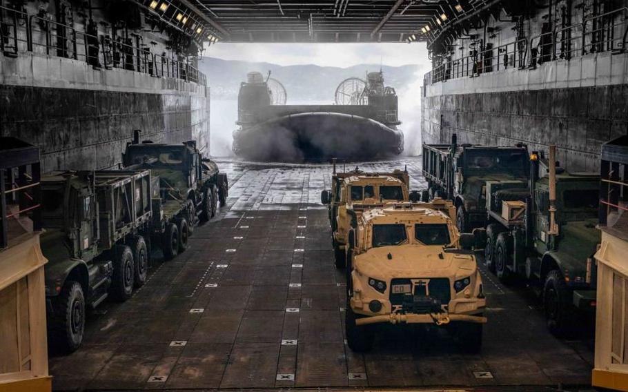 A landing craft, air cushion, assigned to Little Creek-based Assault Craft Unit 4, returns to USS Arlington to load more vehicles as the 22nd Marine Expeditionary Unit disembarks for the U.S.-Greek Alexander the Great 2022 training exercise.