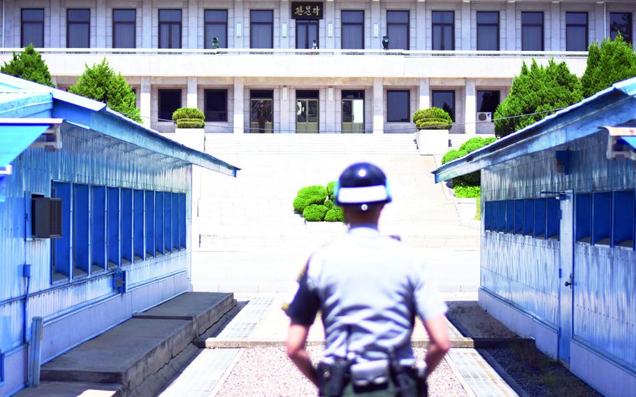 North and South Korean soldiers stand guard in May 2017 at the Joint Security Area of the Demilitarized Zone, which divides the two Koreas.