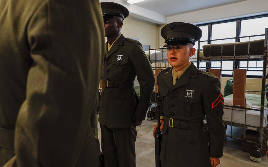 A Marine stands guard near the site of the Marine Battalion