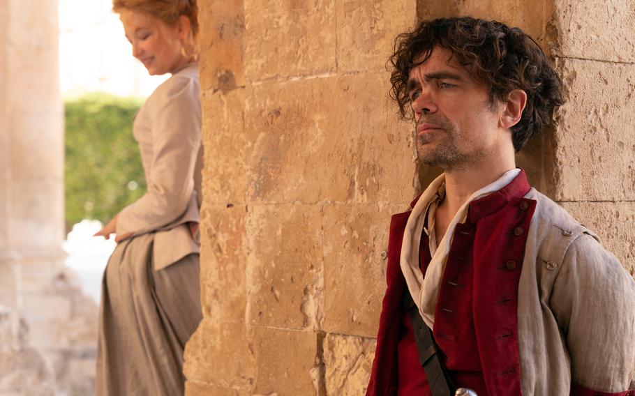 Cyrano, played by Peter Dinklage, right, pines for a women he thinks he cannot have, played by Haley Bennett, left, in “Cyrano.” 