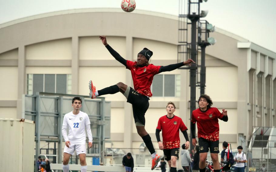 Mykhi Russell jumps high for the ball.
