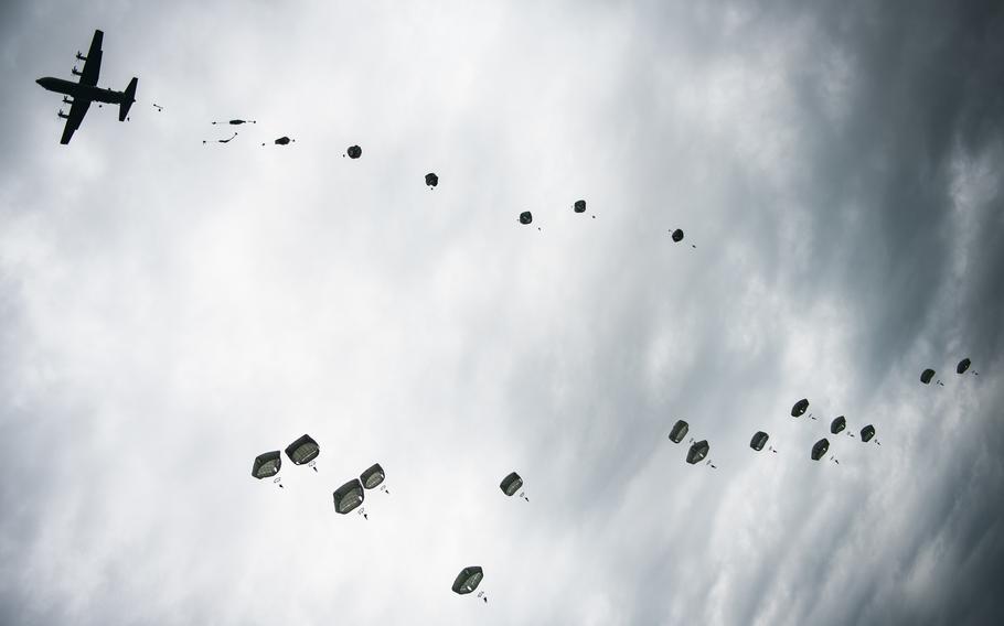U.S. Army paratroopers from the 173d Airborne Brigade conduct a joint airborne operation from a C-130 Hercules aircraft alongside paratroopers from the Lithuanian-Polish-Ukrainian Brigade near Yavoriv, Ukraine on Sept. 25, 2021. The U.S. could send up to 5,000 troops along with aircraft and warships to Eastern Europe in anticipation of a new Russian invasion of Ukraine, according to a news report.