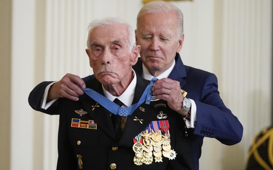 President Joe Biden on Tuesday, July 5, 2022, awards the Medal of Honor to retired Maj. John Duffy during a ceremony in the East Room of the White House in Washington. Duffy received the award for his actions on April 14-15 1972, during the Vietnam War.