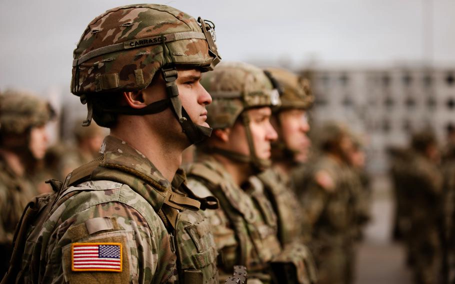 U.S. Army National Guard soldiers stand in formation during a handover ceremony at Bemowo Piskie Training Area, Poland, Feb. 11, 2022. A razor-wire wall will be erected along Poland’s border with the Russian military exclave of Kaliningrad, about 50 miles from Bemowo Piskie.