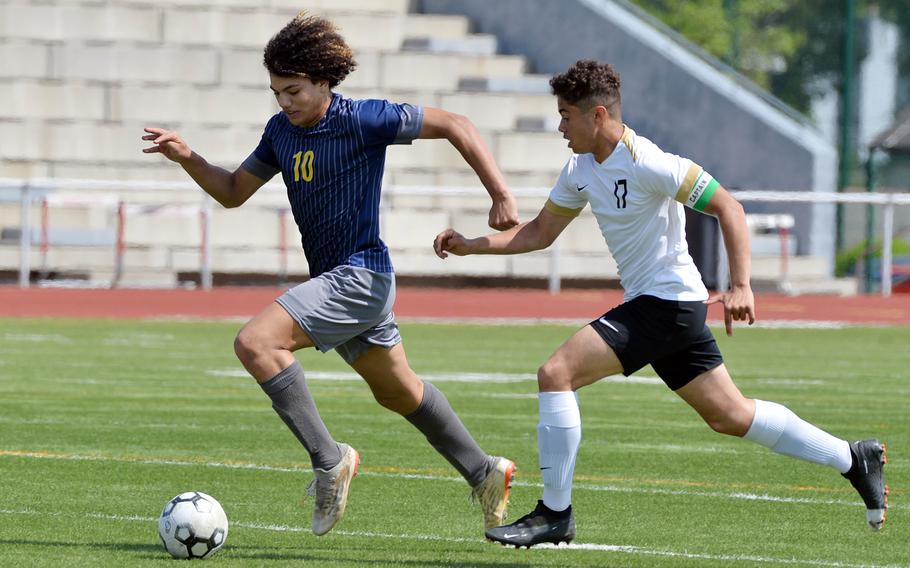 Ansbach’s Daeveon Brown gets away from Alconbury’s Luis Alejandro in a Division III game on opening day of the DODEA-Europe soccer championships in Ramstein, Germany. Ansbach won the game 3-1.