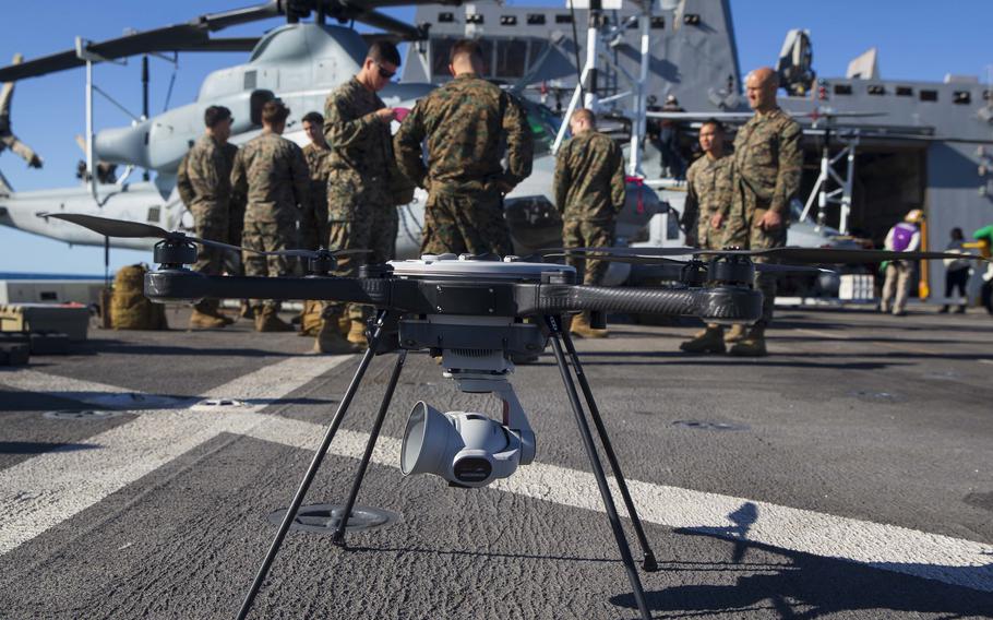 Marines aboard the USS New Orleans prepare to launch a backpackable electronic attack module, or BEAM, in the Coral Sea, July 25, 2021. The system can detect the radio frequency of a specific threat, a hostile drone, for example, locate it and take it out.