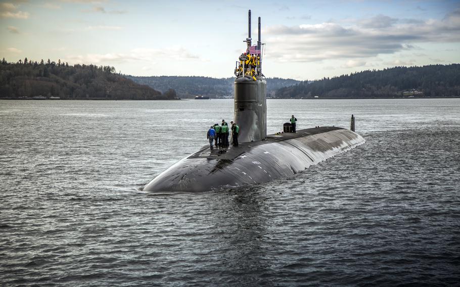 The USS Connecticut departs Puget Sound Naval Shipyard in Bremerton, Wash., Dec. 15, 2016. 