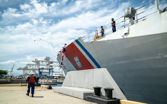 U.S. Coast Guardsmen assigned to the maritime security cutter USCGC Kimball (WMSL 756) throw a heaving line to the pier on Coast Guard Base Honolulu May 5, 2025. While at sea, Kimball's crew countered transnational criminal organizations and prevented dangerous illegal narcotics from reaching the United States. (U.S. Coast Guard photo by Petty Officer 2nd Class Tyler Robertson)
