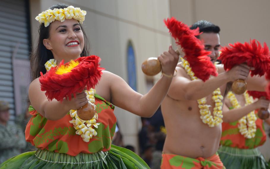Hula dancers perform for the crew of the Daniel Inouye as the ship arrives Nov. 18, 2021, after a 7,600-mile journey from Maine to Joint Base Pearl Harbor-Hickam, Hawaii.