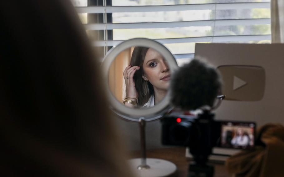Christian social media influencer Michel Janse records a video in her home office in Oceanside, Calif., this month. AI was used to create a video with Janse’s likeness for an erectile dysfunction advertisement. 