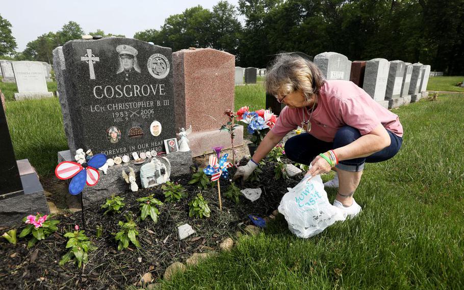 Gold Star Mother Charlene Cosgrove-Bowie visits and clean up her sons grave, Lance Cpl. Christopher B. Cosgrove III at Gate of Heaven Cemetery in East Hanover, N.J., May, 19, 2022